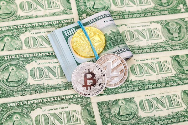 Folded american dollar bills wrapped by rubber band with cryptoc