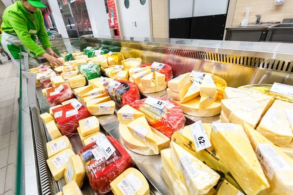 Tasty cheese in the showcase ready to sale — Stock Photo, Image