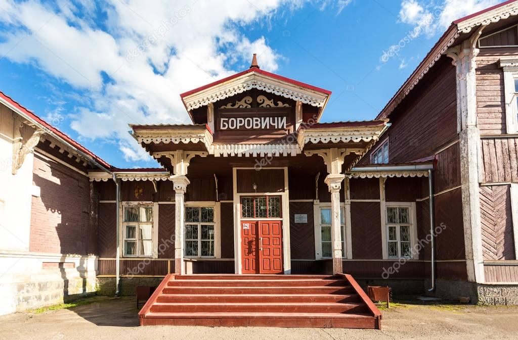 Old wooden provincial railway station with platform in summer su