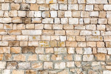 Arka plan doku olarak yıpranmış gri taş duvar