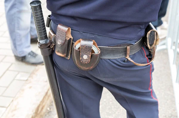 Russian policeman with gun belt, handcuffs gun and holster