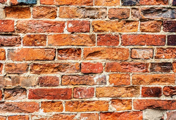 Pared de ladrillo rojo áspero como textura de fondo — Foto de Stock