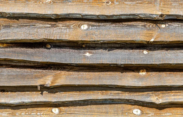 Tavole di legno grezzo con crepe come sfondo — Foto Stock