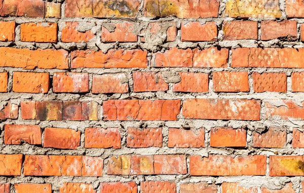 Mur de brique rouge rugueux comme texture de fond — Photo
