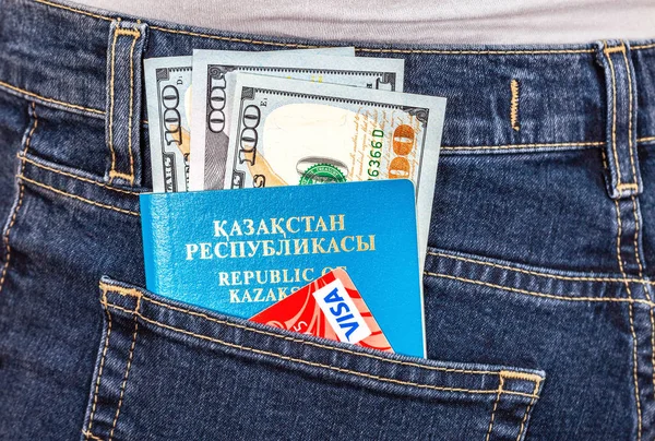 Kazakhstan passport with dollar banknotes and Visa card — Stock Photo, Image