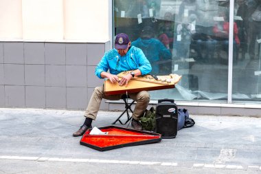Musician playing on musical folk instrument
