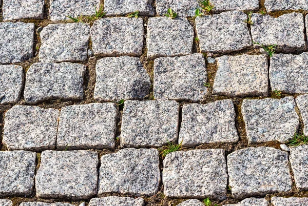 Taş bloklardan yapılan kaldırım taşlarının arka planı — Stok fotoğraf