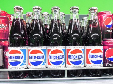 Samara, Russia - February 23, 2020: Pepsi Cola bottled ready for sale on the shelf in superstore. Various bottled beverages and non alcoholic drinks