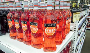 Samara, Russia - February 29, 2020: Bottled alcoholic beverages Cin&Cin vermuth ready for sale on the shelf in grocery store