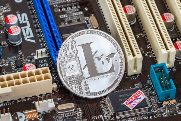Samara, Russia - December 11, 2017: Cryptocurrency Litecoin lying over electronic computer component. Business concept of digital money — Stockbild Samara Russia December 2017 Cryptocurrency Litecoin Lying Electronic Computer Component — Stockfoto