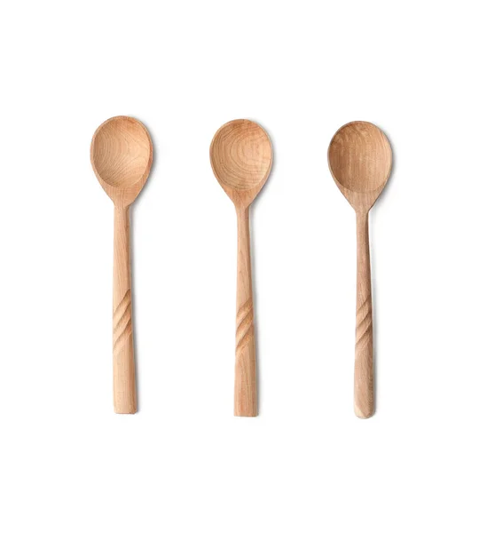 Three teaspoons of natural wood. Isolated on white background — Stock Photo, Image