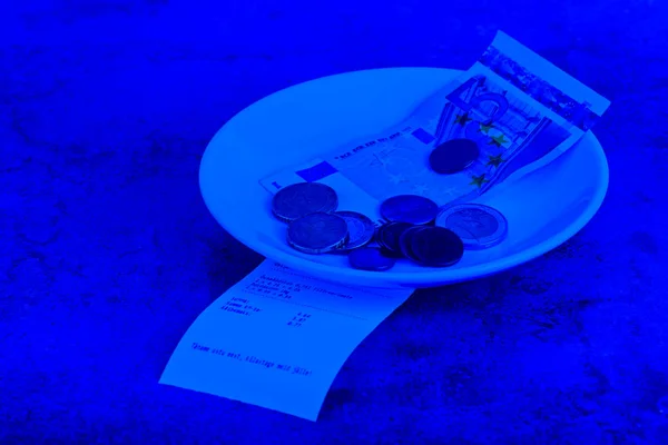 Tip on a restaurant table. Blue toned. — Stock Photo, Image