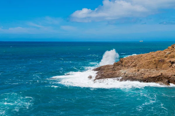 Beautiful cerulean sea and the rock