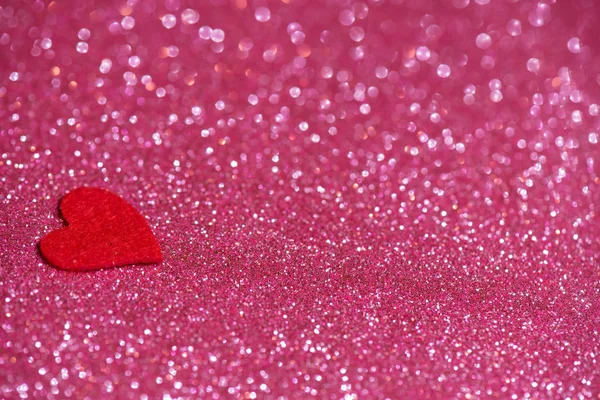 Corazón sobre fondo abstracto rosa con bokeh —  Fotos de Stock