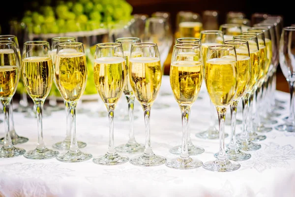 Glasses of champagne waiting for guests, rustic toned — Stock Photo, Image