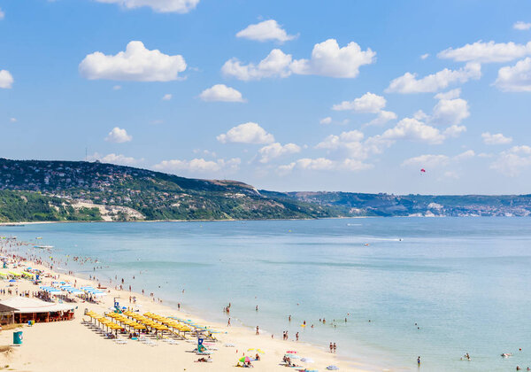 The Black Sea shore, blue clear water, beach with sand, umbrellaand sunbeds. Albena, Bulgaria