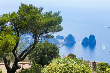 Italy. Island Capri. Faraglioni rocks and boats from Monte Solar clipart
