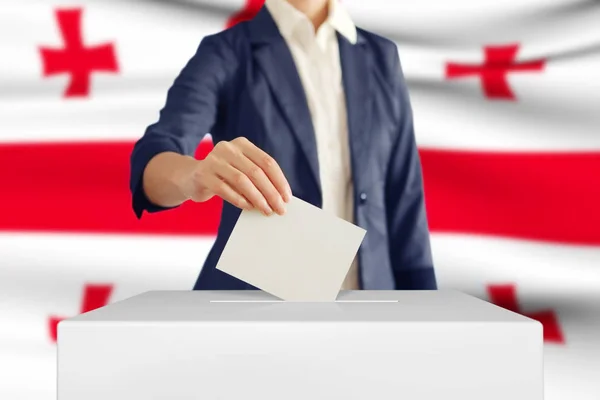 Voting. Woman putting a ballot. — Stock Photo, Image