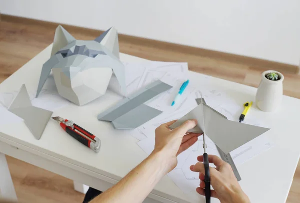 Making paper wolf head.