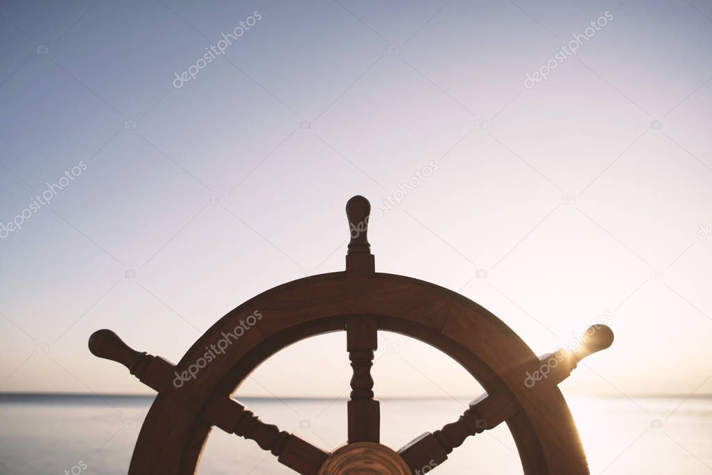 Ship rudder with sea on background.   