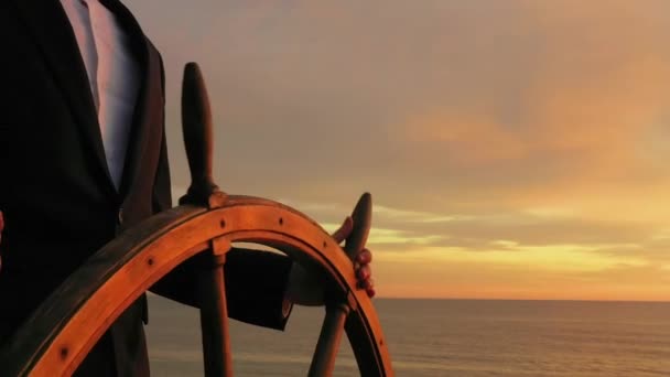 Businessman Holding Ship Rudder Steers Sunset Light — Stockvideo