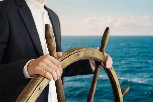 Businessman Holding Ship Rudder Navigates Ocean — Stock Photo, Image