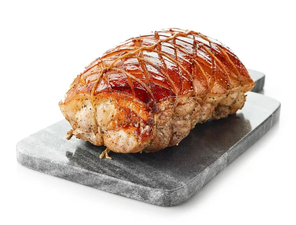 Gri kesme tahtası üzerinde kavrulmuş domuz eti — Stok fotoğraf