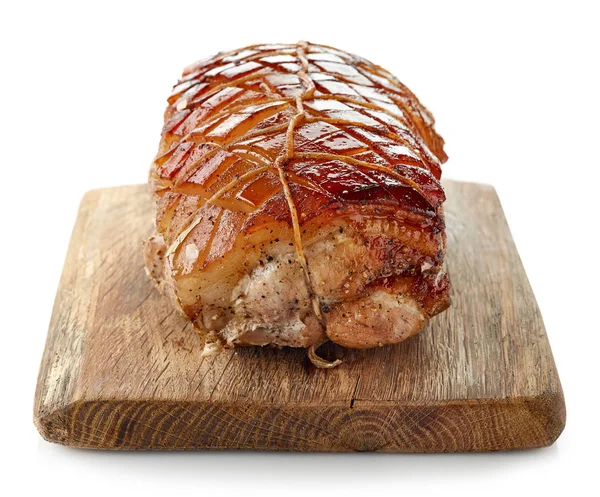 Roasted pork on wooden cutting board — Stock Photo, Image