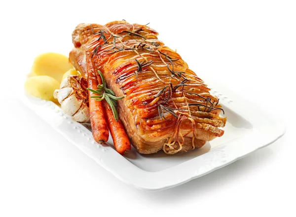 Roasted pork and vegetables on white plate — Stock Photo, Image