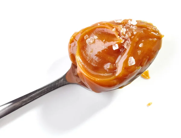 Spoon of soft homemade caramel — Stock Photo, Image