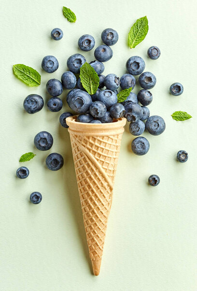 fresh blueberries in ice cream cone