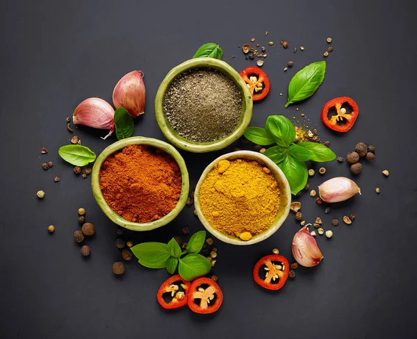Various spices on black background — Stock Photo, Image