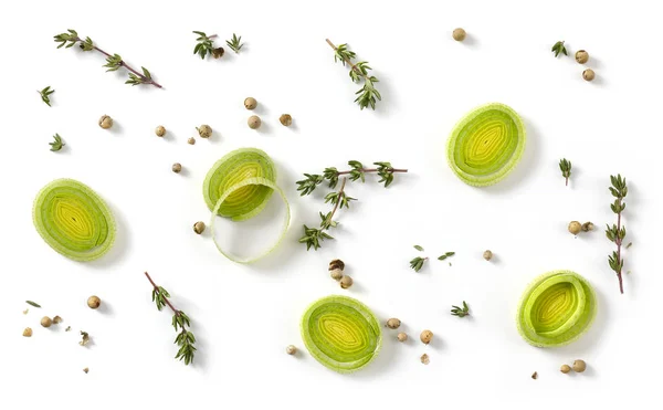 Leek slices and spices on white background — Stock Photo, Image