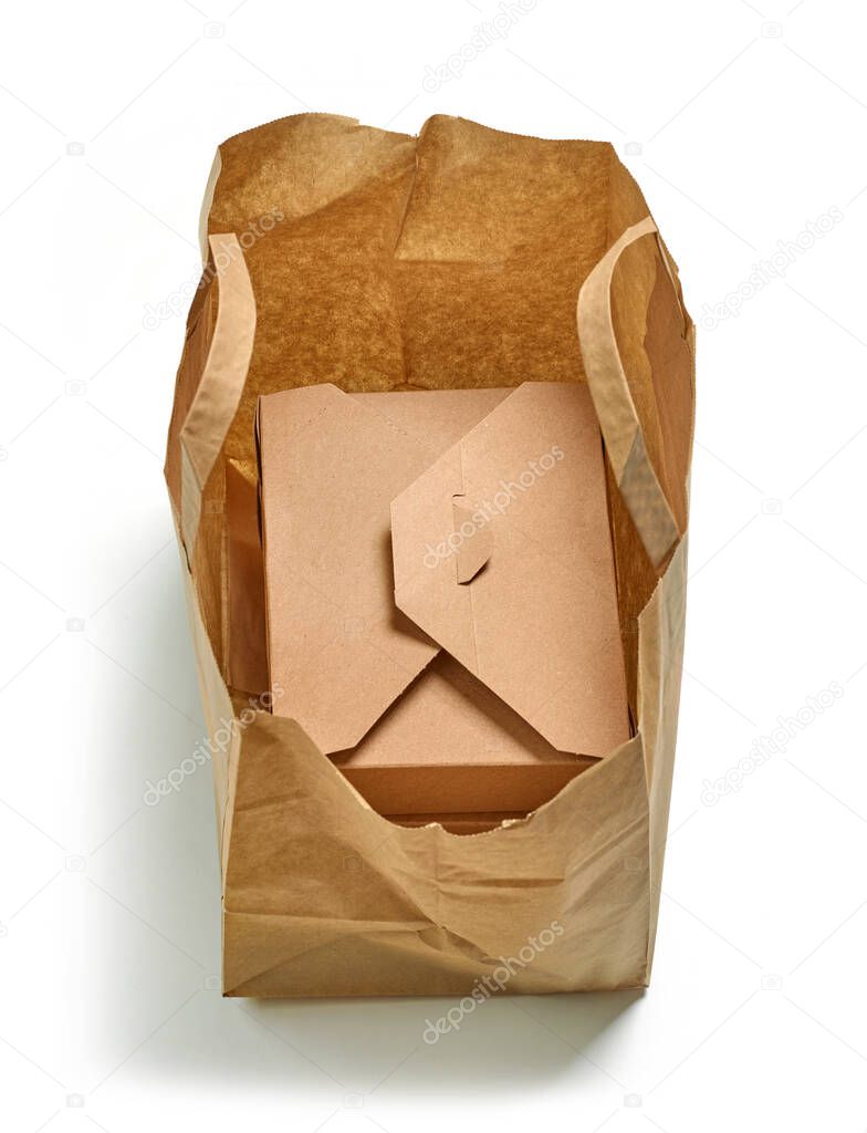 cardboard box in paper bag isolated on white background, food delivery