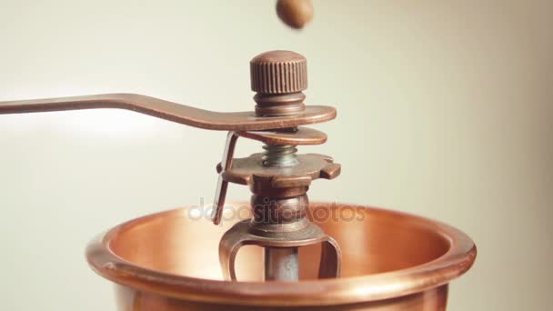Coffee beans falling into vintage grinder in slow motion — Stock Video