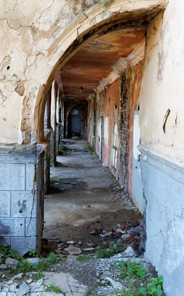 old door and the arch in the crumbling building