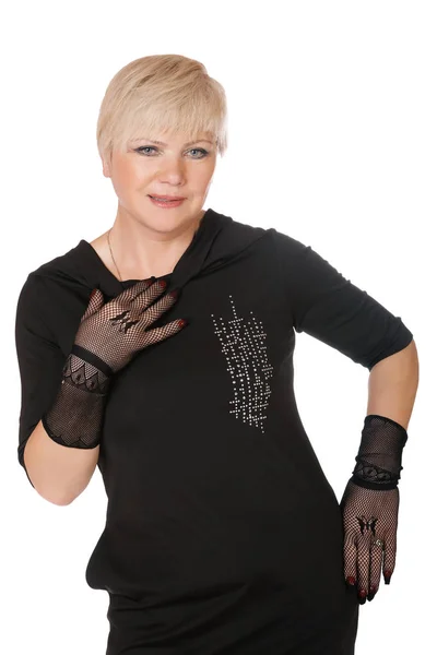 Orta yaşlı bir kadın beyaz bir arka plan üzerinde eldiven — Stok fotoğraf