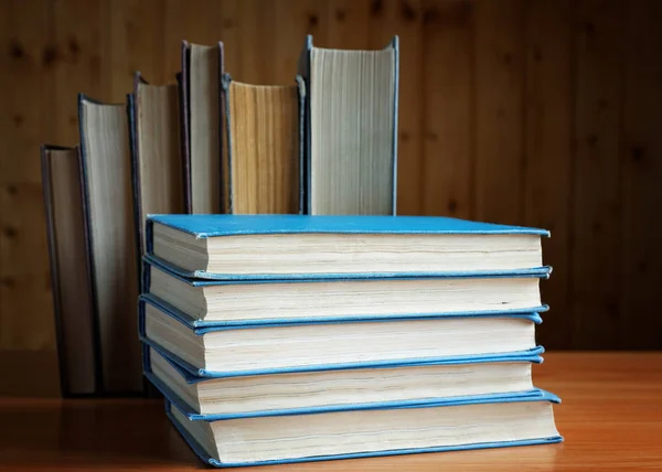 Old books in brown and blue cover close up — Stock Photo, Image