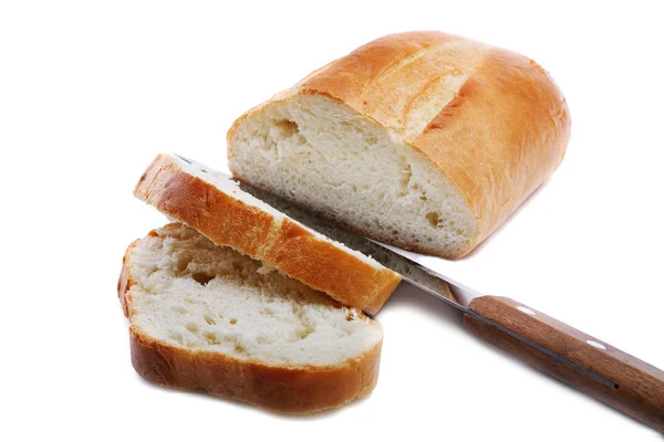 Sliced white bread with a knife on a white background — Stock Photo, Image