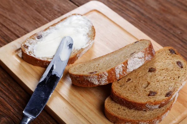 Sliced bread smeared with butter close-up — Stock Photo, Image