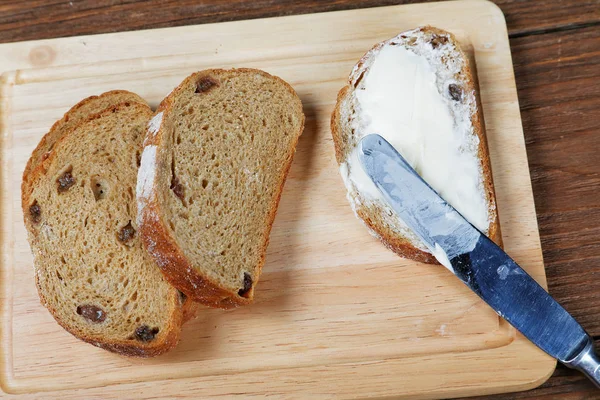 Sliced bread smeared with butter close-up — Stock Photo, Image