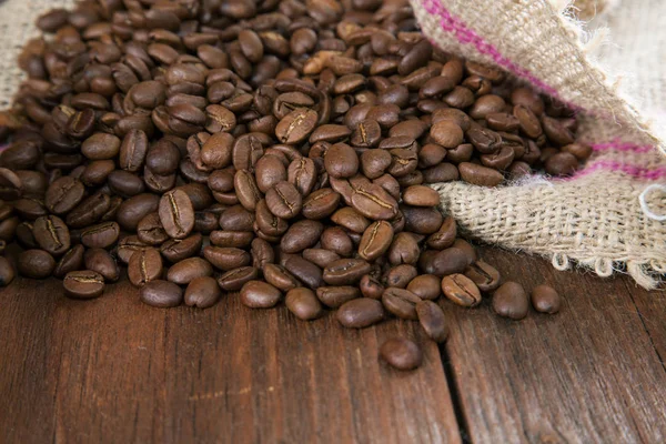 COFFEE GRAIN IN A BAG ON A RURAL TABLE — Stock Photo, Image
