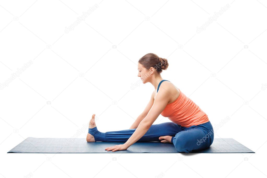 Woman doing Ashtanga Vinyasa Yoga asana Janu sirsasana