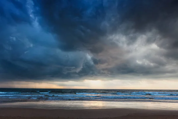 Gathering storm on beach — Stock Photo, Image