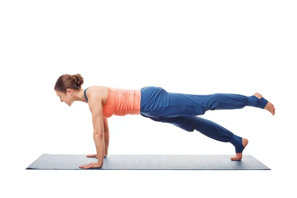 Woman doing Hatha yoga asana Utthita chaturanga dandasana — Stock Photo, Image