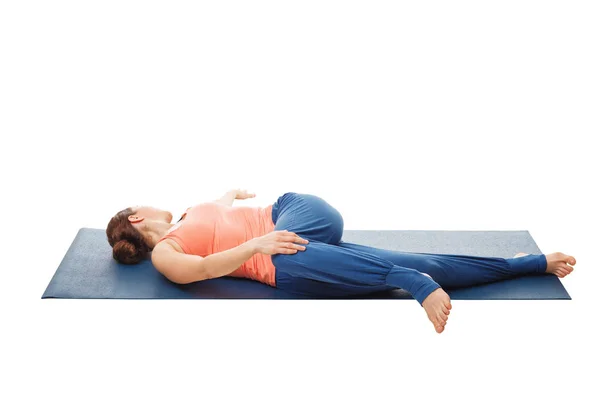 Woman doing Yoga asana Parivrtta ardha pawanmuktasana isolated — Stock Photo, Image