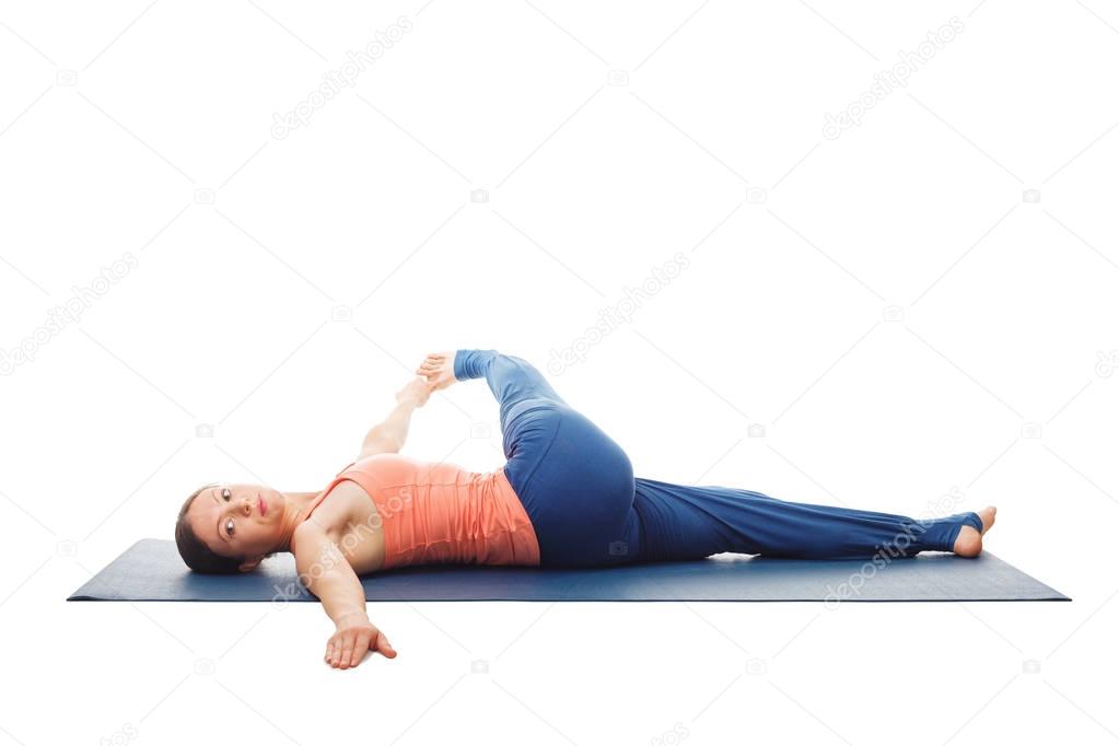 Woman doing Yoga asana Revolved knee-to-chest Pose isolated