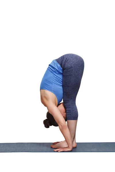 Mulher fazendo ioga asana Uttanasana - pé para a frente curva — Fotografia de Stock