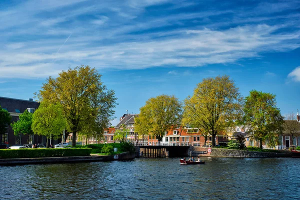 Boat in canal and Spaarne river in Haarlem, Netherlands — Stock Photo, Image