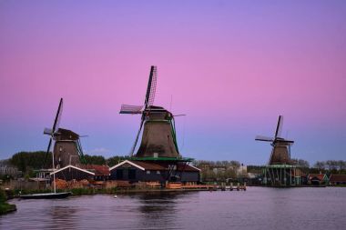 Windmills at Zaanse Schans in Holland in twilight after sunset. clipart